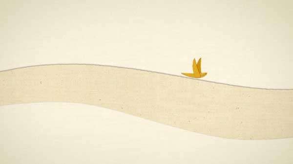 A paper bird flies across a paper landscape