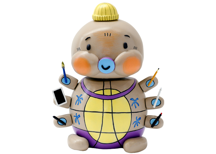A colourful turtle character holding pens and pencils 